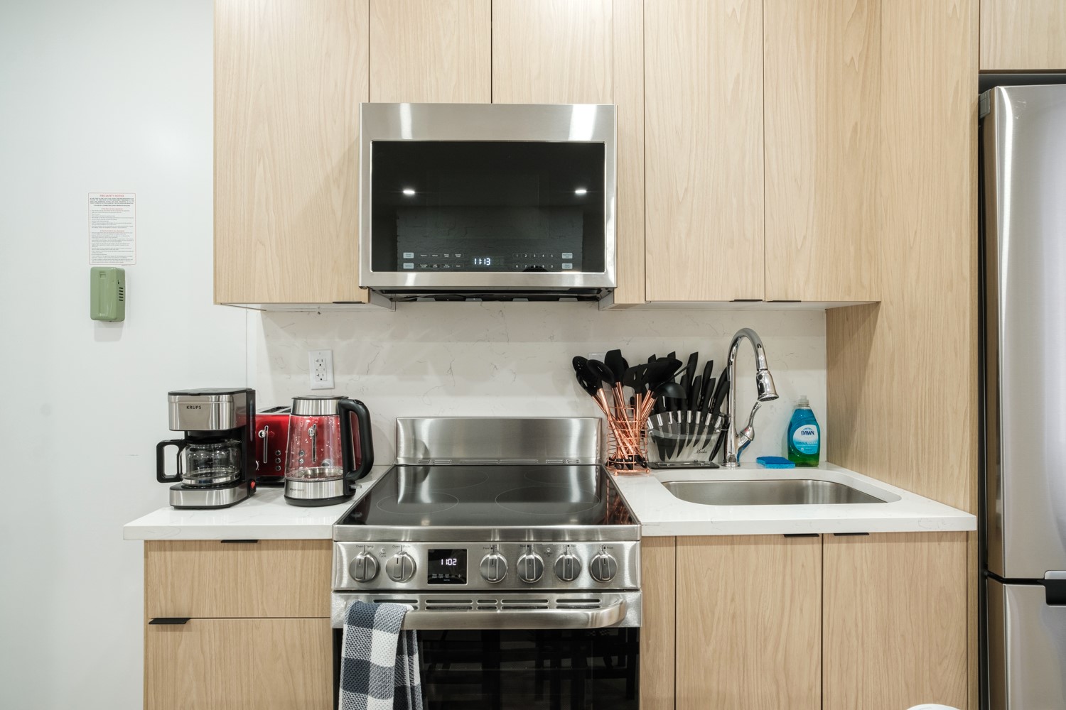 Kitchen with light wood cabinets